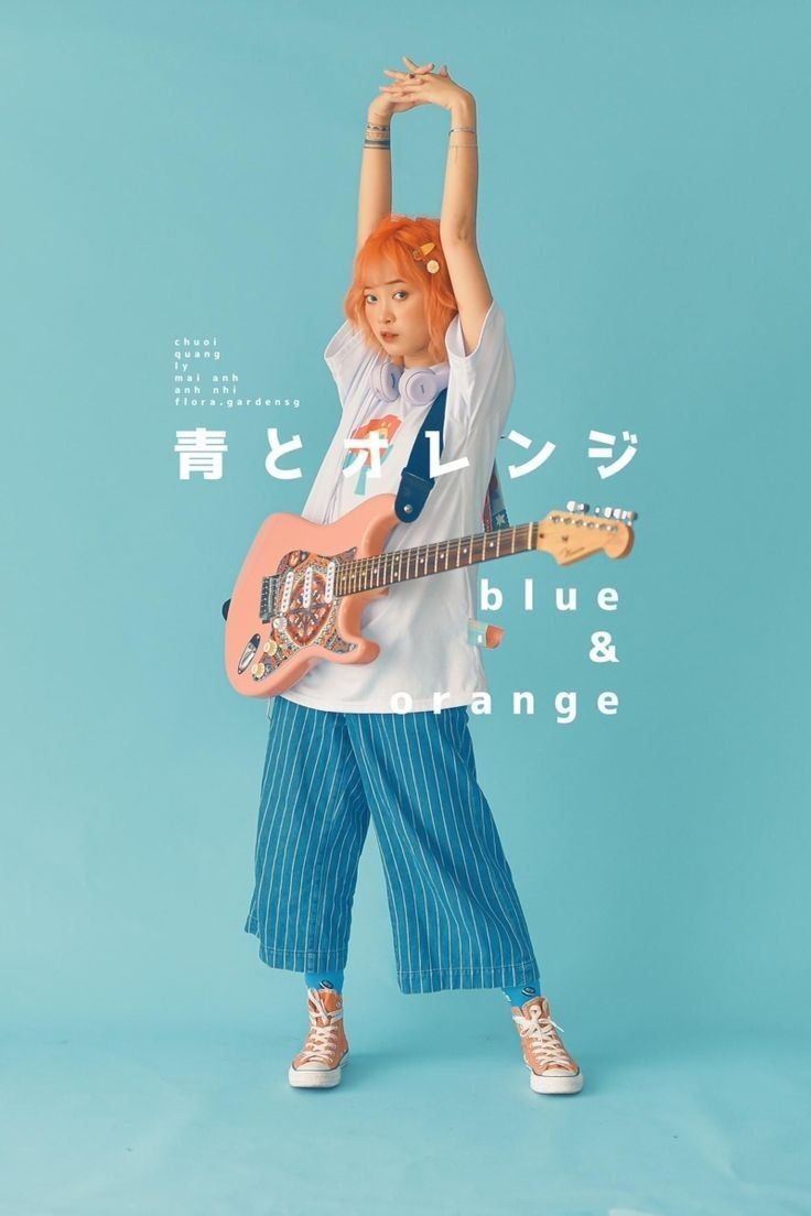 A girl with orange hair bending and holding a similar color guitar. The background is blue.